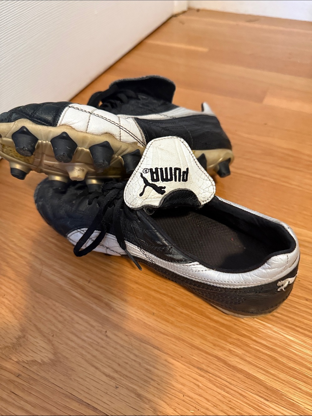 Puma Black and White Soccer Cleats with Gold Studs